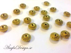 Mellandel mönstrad rondell, antikguld, 8x5mm, 20-pack