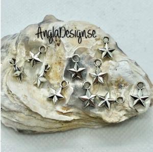 Berlock liten facetterad stjärna i antiksilver, 10-pack