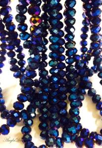 Glasrondeller facetterade 10x8mm, oljeskimrande blå, 1 sträng