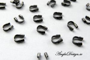 Wireskydd avslut, svarta/gunmetall, 10-pack