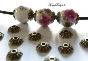 Pärlhatt 8mm, brons, 12-bladig blomma, 20-pack