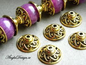 Pärlhatt antikguld, 15mm snirklig, 10-pack