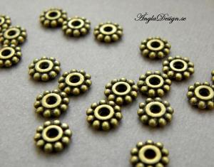 Mellandel daisy 6,5mm, brons, 20-pack