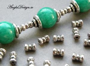 OBS! Andrasortering, Mellandel antiksilver liten rosett, 30-pack