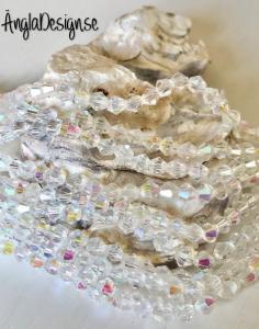 Glaspärla bicone Crystal 4mm klar med AB lyster, 1 sträng