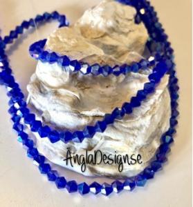 Glaspärla bicone Crystal 4mm mörkblå med AB lyster, 1 sträng