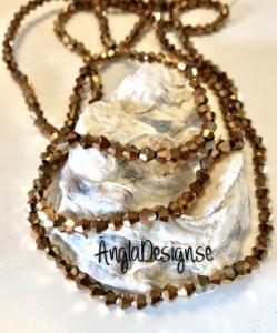 Glaspärla bicone Crystal 4mm brons med elektropläterad lyster, 1 sträng