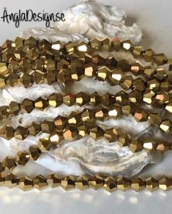 Glaspärla bicone Crystal 4mm guld med elektropläterad lyster, 1 sträng