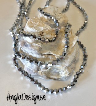 Glaspärla bicone Crystal 4mm silver med elektropläterad lyster, 1 sträng