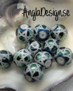 Glaspärla 8mm rund med stjärnmönster grön ,10-pack