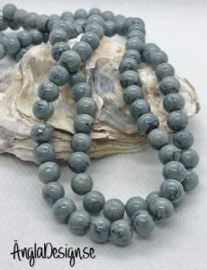 Glaspärla drawbench grå med gråsvart stänk på, 6mm, 1 sträng