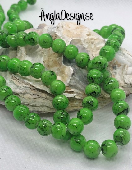 Glaspärla drawbench grön med svart stänk på, 6mm, 1 sträng