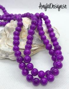 Glaspärla drawbench lila med svart stänk på, 6mm, 1 sträng