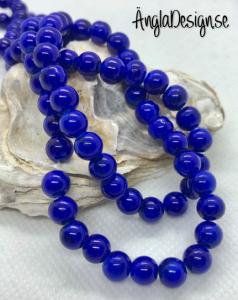 Glaspärla drawbench mörkblå med svart stänk på, 6mm, 1 sträng