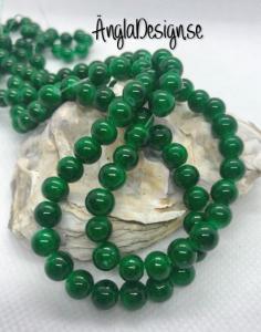 ANDRASORTERING Glaspärla drawbench mörkgrön med svart stänk på, 6mm, 1 sträng