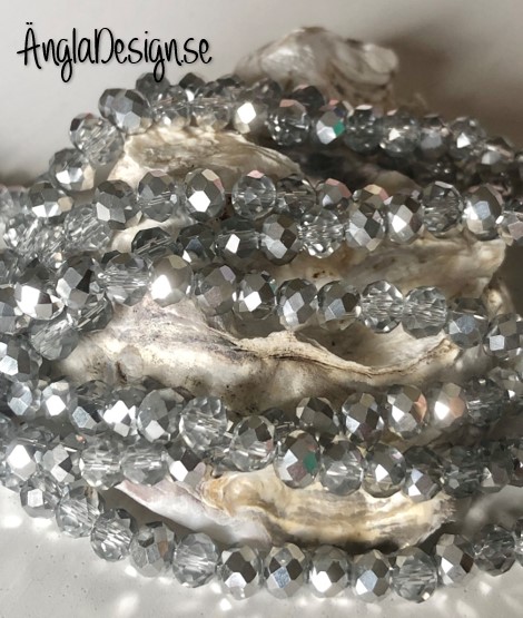 Glasrondell, facetterad 6x4mm silver, 1 sträng