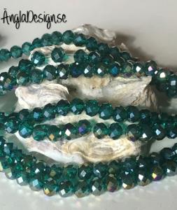 Glasrondell, facetterad 6x4mm emerald med AB lyster, 1 sträng