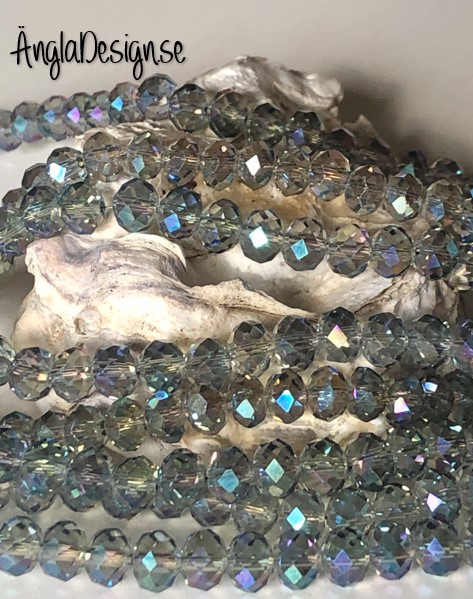 Glasrondell, facetterad 6x4mm grå multi med AB lyster, 1 sträng