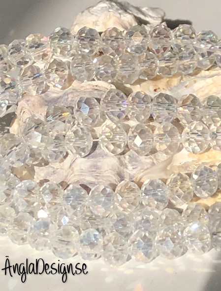 Glasrondell, facetterad 6x4mm klar med AB lyster, 1 sträng