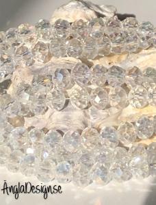 Glasrondell, facetterad 6x4mm klar med AB lyster, 1 sträng