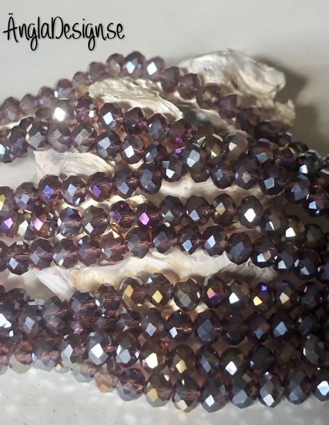 Glasrondell, facetterad 6x4mm lila med AB lyster, 1 sträng