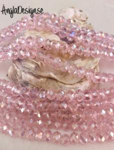 Glasrondell, facetterad 6x4mm rosa med AB lyster, 1 sträng