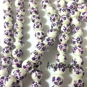 Porslinspärlor 8mm lila blommiga, 10-pack