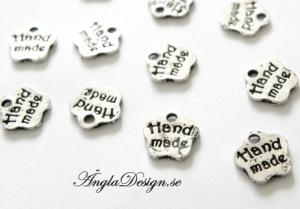ANDRASORTERTING Berlock liten söt blomma antiksilver "Hand made", 20-pack