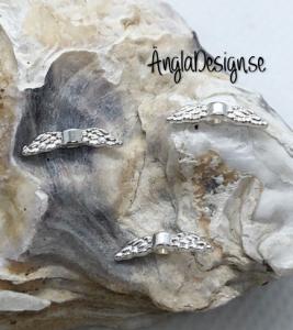 Mellandel änglavinge i ljust silver, 20-pack