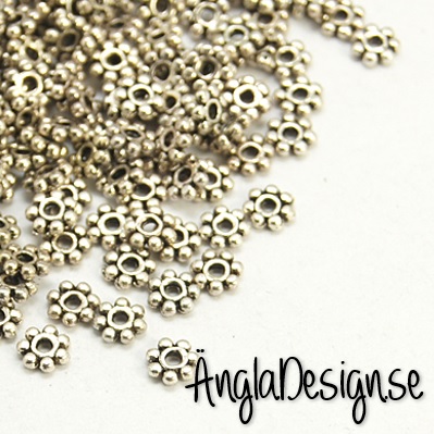 Mellandel daisy 4mm antiksilver, 50-pack