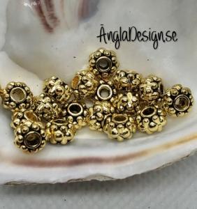 Mellandel rondell 6,5x4mm antikguld, 20-pack