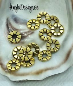 Mellandel tunn rondell 8mm i antikguld, 20-pack