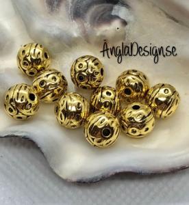 Mellandel rund 8mm med cirkelmönster, antikguld, 10-pack