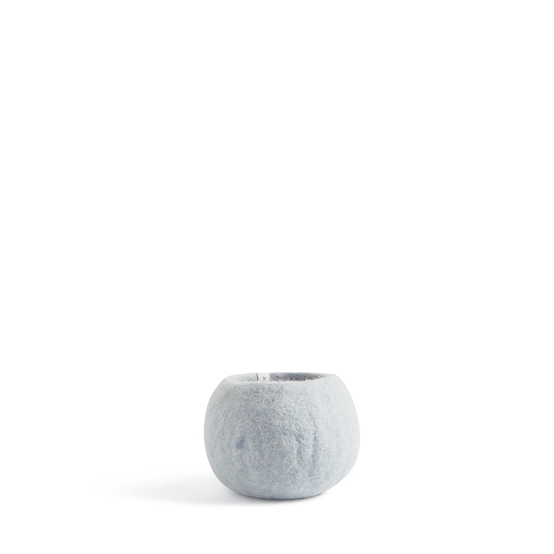 Small rounded flower pot in light blue made of wool.