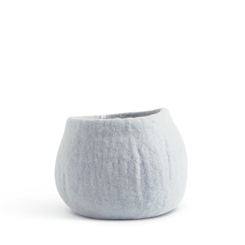Medium rounded flower pot in light blue made of wool.