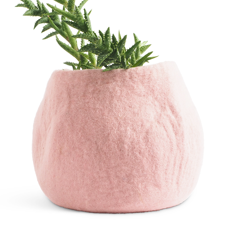 Large rounded flower pot in pink made of wool.