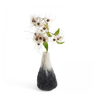 Large grey and white ombre vase made of wool with a glass for the flowers.