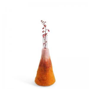 Large orange and pink ombre vase made of wool with a glass for the flowers.