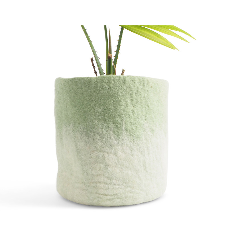 Large flower pot made of wool in sage green - white with an ombre effect.