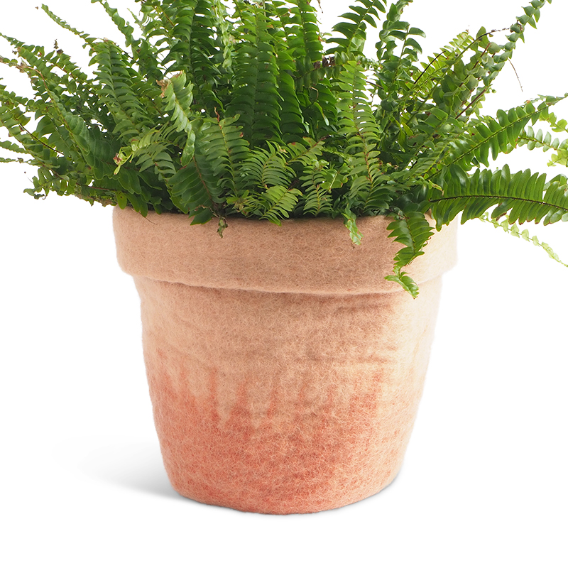 Large flower pot made of wool in pink with an ombre effect.