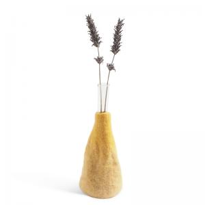 Ochre and white ombre vase made of wool with a glass inside for the flowers.