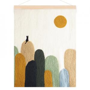 Poster in wool with a motive of a cat on hills. Colors in sand, sage green, moss green and ochre.