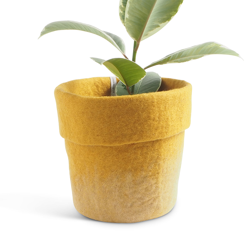 Large flower pot made of wool in ochre color.