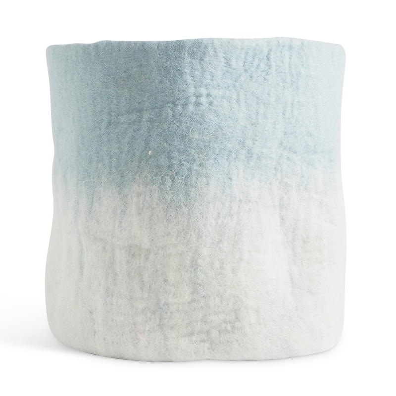 Large flower pot in light blue and white made of wool with ombre effect.