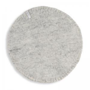 Round Raw grey seat cushions made with naturally dyed wool features the same colour on the top and underside,  and has a beautiful handstitched rim