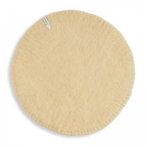 Round sand seat cushions made with naturally dyed wool features the same colour on the top and underside,  and has a beautiful handstitched rim