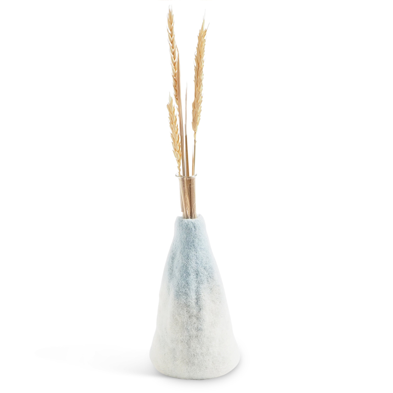 Light blue and white ombre vase made of wool with a glass inside for the flowers.