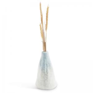 Light blue and white ombre vase made of wool with a glass inside for the flowers.