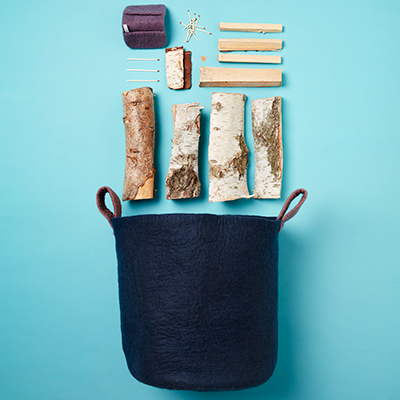 Big basket in wool with firewood