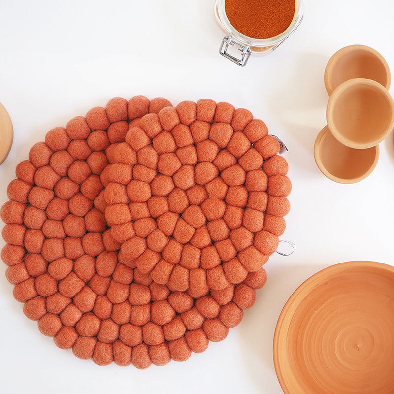 round small and large terracotta trivet in wool